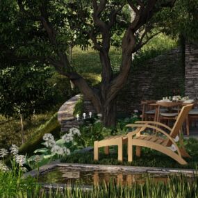 Outdoor dining terrace under tree canopy with hillside views